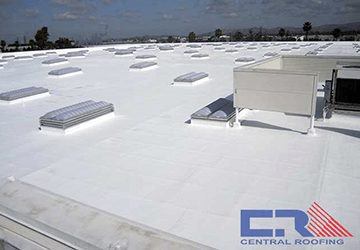canon White industrial roof with skylights and air conditioning unit